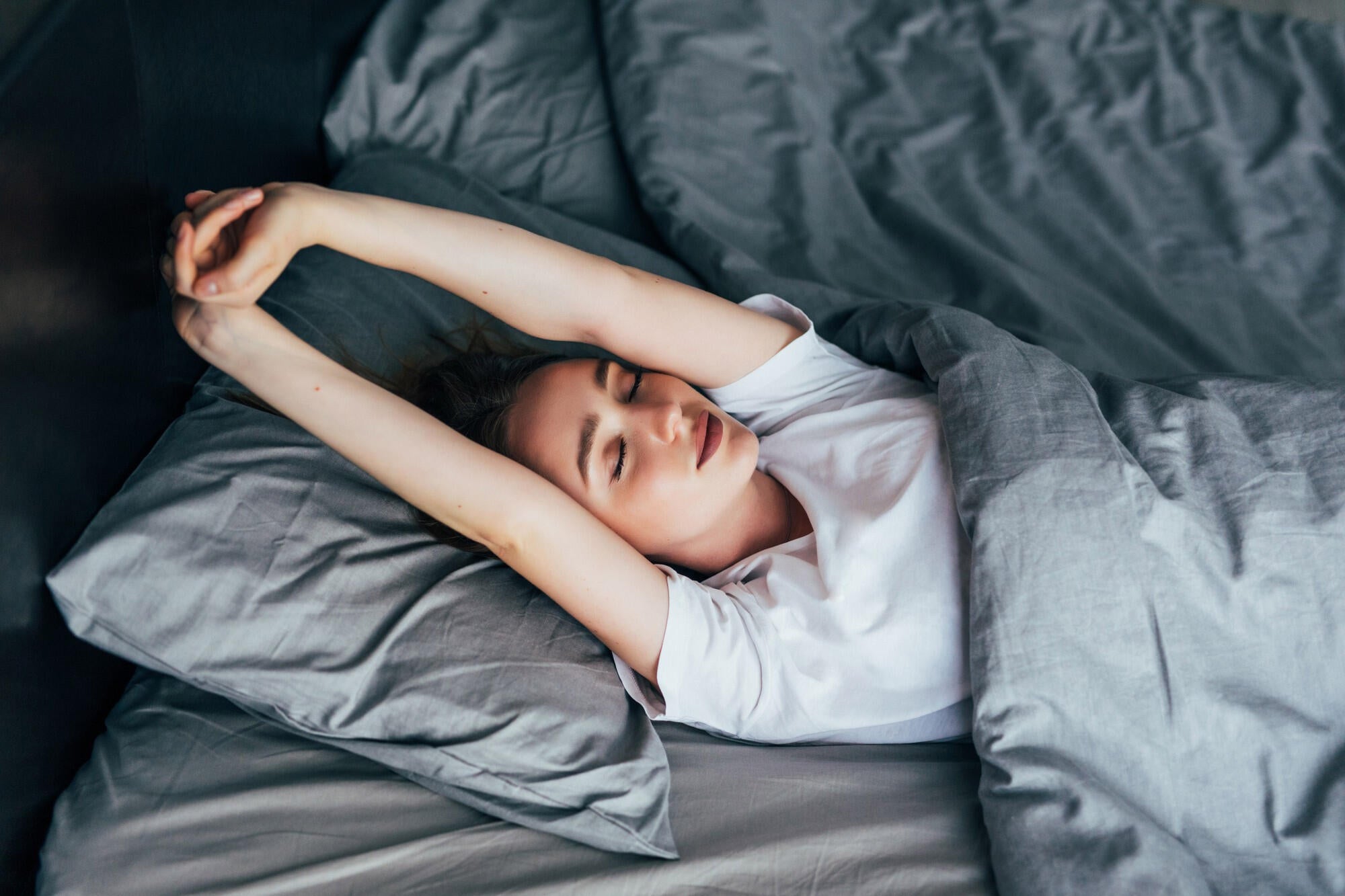A person taking the RUSATED sleep assessment test, indicating their level of daytime sleepiness.