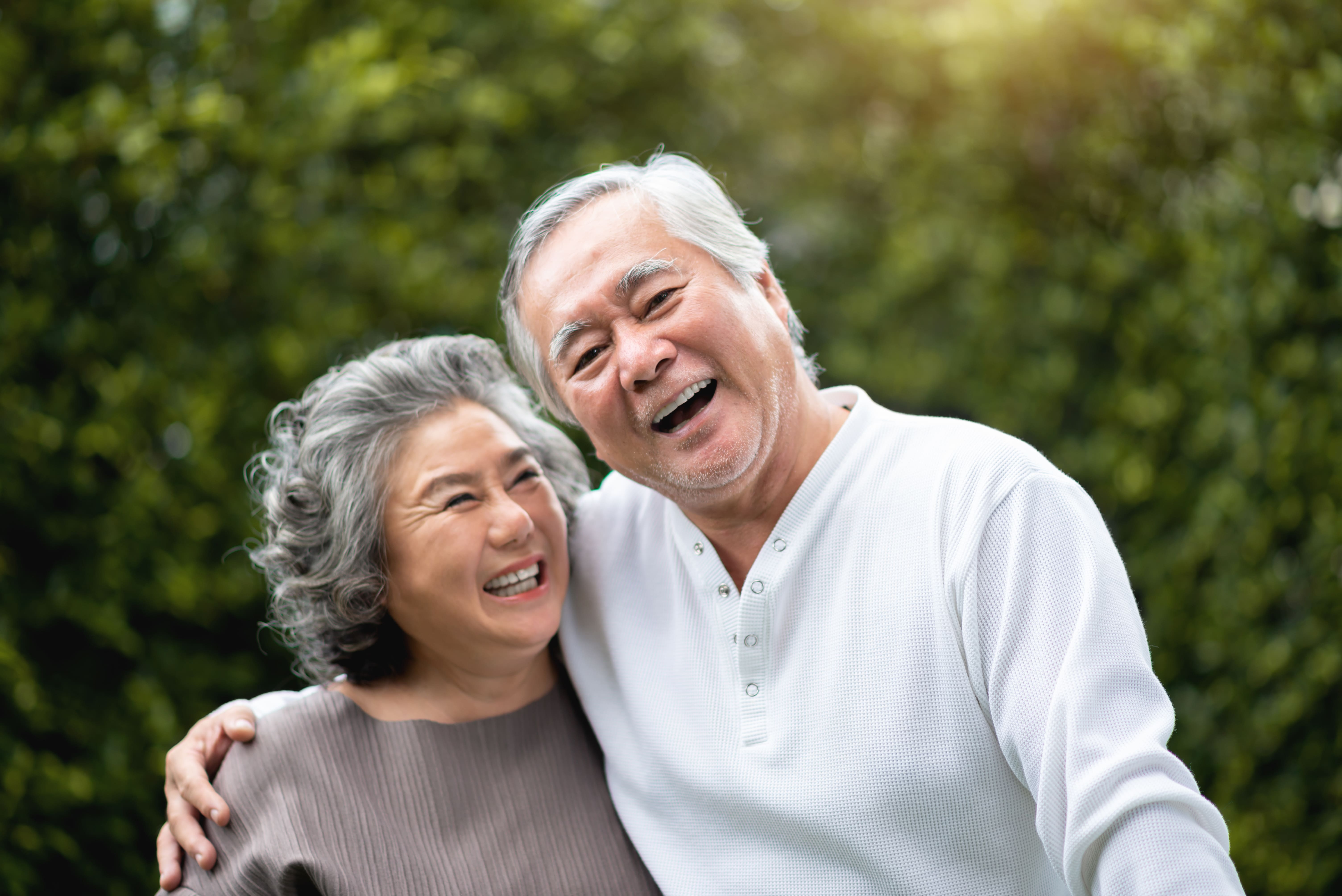 Happy elder couple having better sleep after using CPAP Singapore Machine with SG Medical